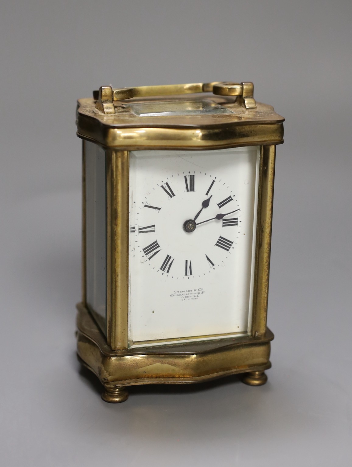 A Steward & Co brass cased carriage timepiece, 13cm